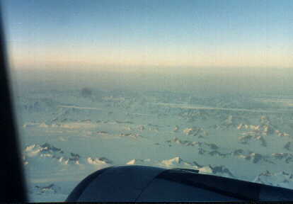 Ice-enslaved peaks jutting above the permanent cap of Greenland.
