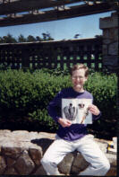 Adam at pool with magazine